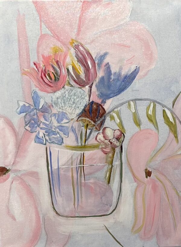 A vase of flowers on a pink background